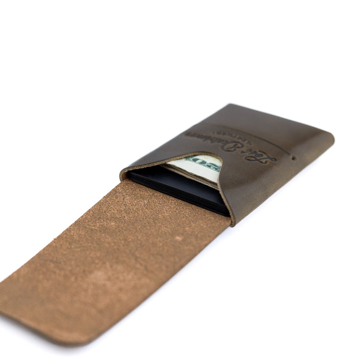 Brown leather wallet with money clip on a white background