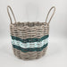 Woven basket with striped pattern on a white background