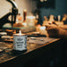 Candle on a table with a blurred background of people and lights