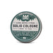 Solid cologne tin with label on a white background