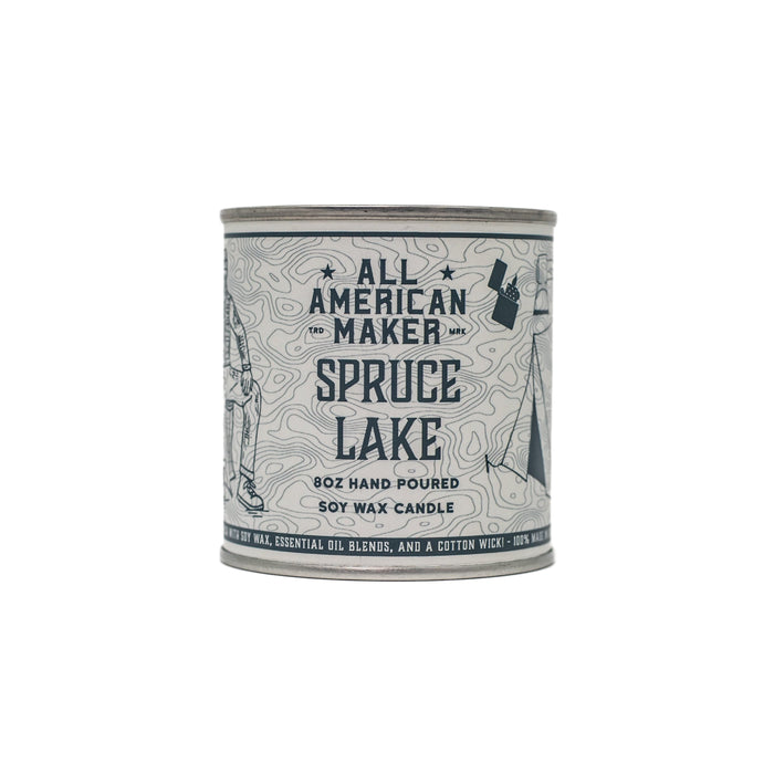 Candle container labeled 'All American Maker Spruce Lake' on a white background