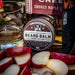 Beard balm container with sliced apples and a bottle of Knob Creek bourbon.
