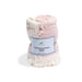 Pink baby blanket with a label on a white background