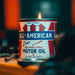 Candle in a can labeled 'All American Pure High Grade Candle Motor Oil' with a flame.