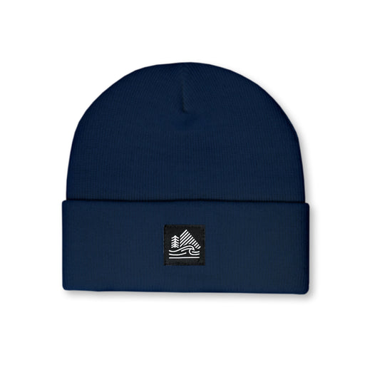 Navy blue beanie with a logo patch on a white background