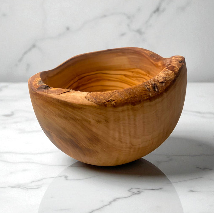 Wooden bowl on a marble surface