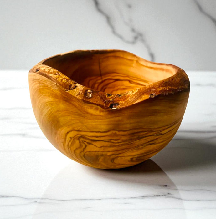 Wooden bowl on a marble surface