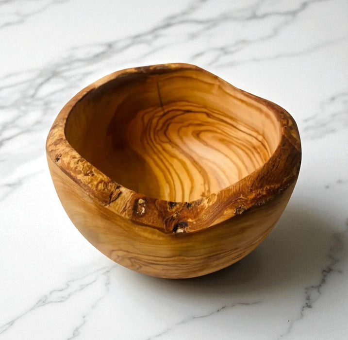 Wooden bowl on a marble surface