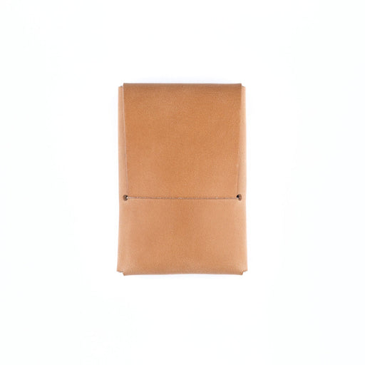 Tan leather notebook on a white background
