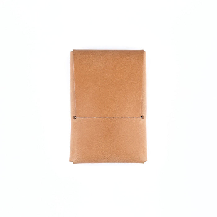 Tan leather notebook on a white background