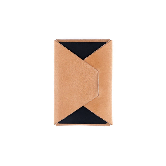 Rectangular cardholder with tan leather front and black interior on a white background
