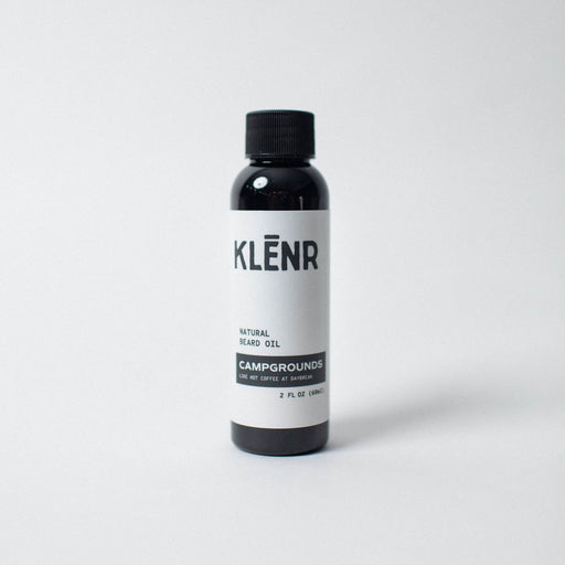 Bottle of KLénr natural bears oil on a white background