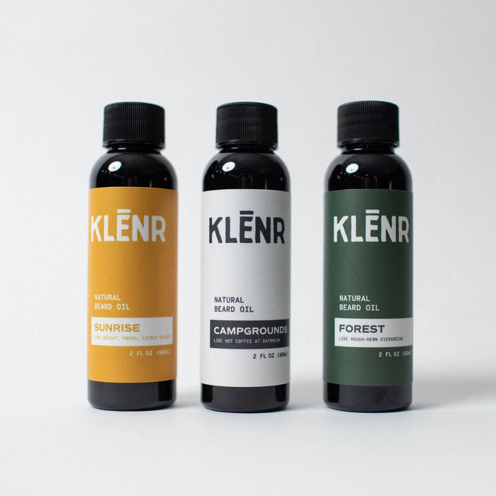 Three bottles of Klenr natural hair gel on a white background