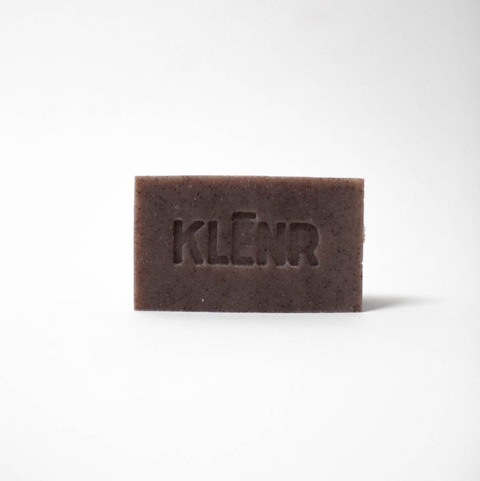 Brown bar of soap with 'KLEEN' branding on a white background