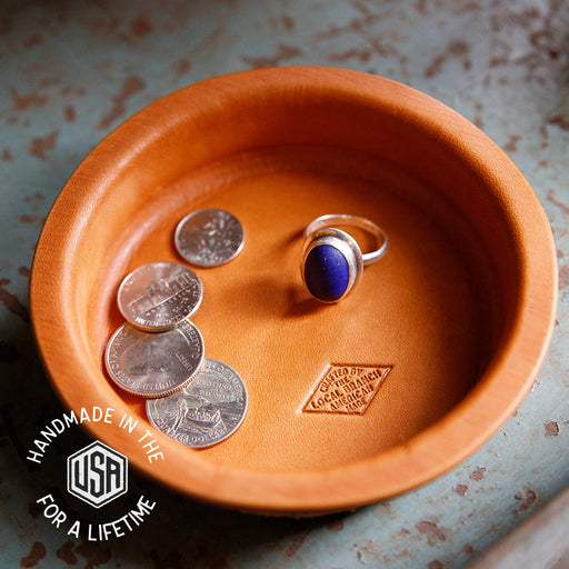 Terracotta dish with coins and a ring, featuring 'Handmade in the USA for a Lifetime' branding.