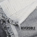 Gray and white reversible fabric with text indicating 4 layers of thin muslin cotton.