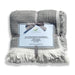 Gray and white reversible muslin cotton blanket with a label on a white background
