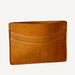 Brown leather cardholder on a white background