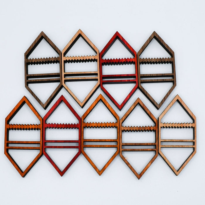 Set of geometric wooden wall art pieces on a light gray background