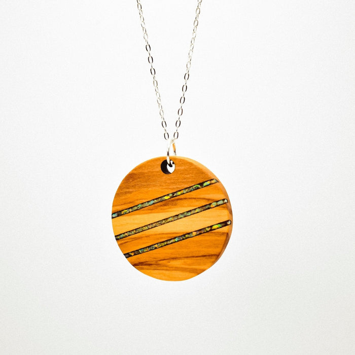 Wooden pendant necklace on a white background