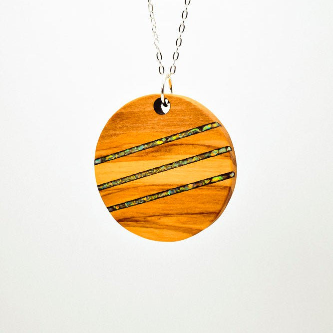 Wooden pendant necklace with a white background